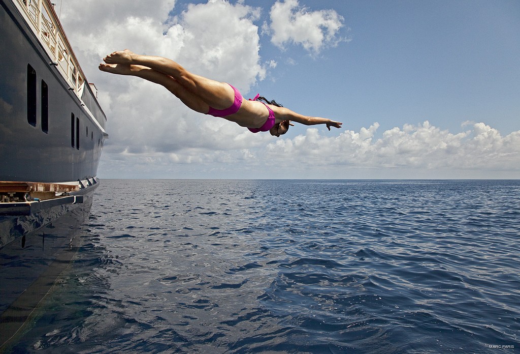 Woman Dive On Yacht SEAWOLF