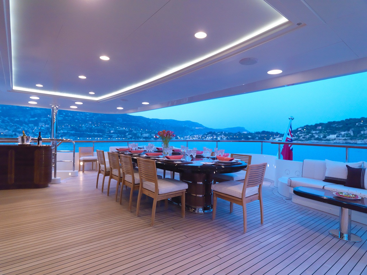 luxury dining set up at sunset on the upper deck outside