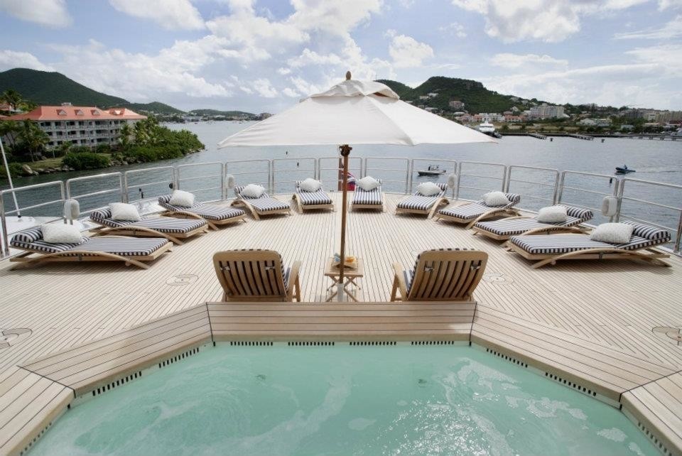 Jacuzzi Pool With Sunshine Lounging On Board Yacht FREEDOM