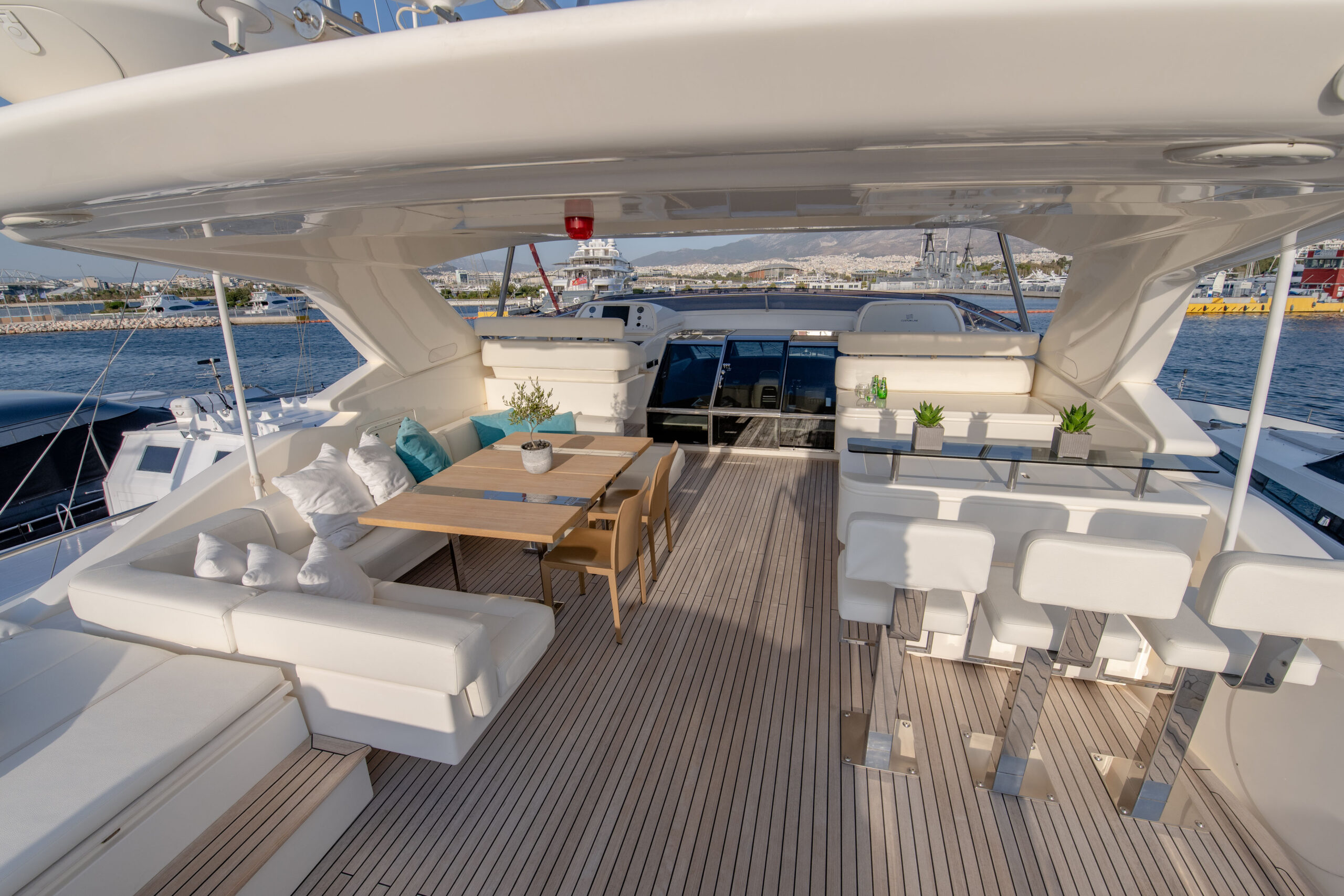 Sun deck with bar, dining table and helm station