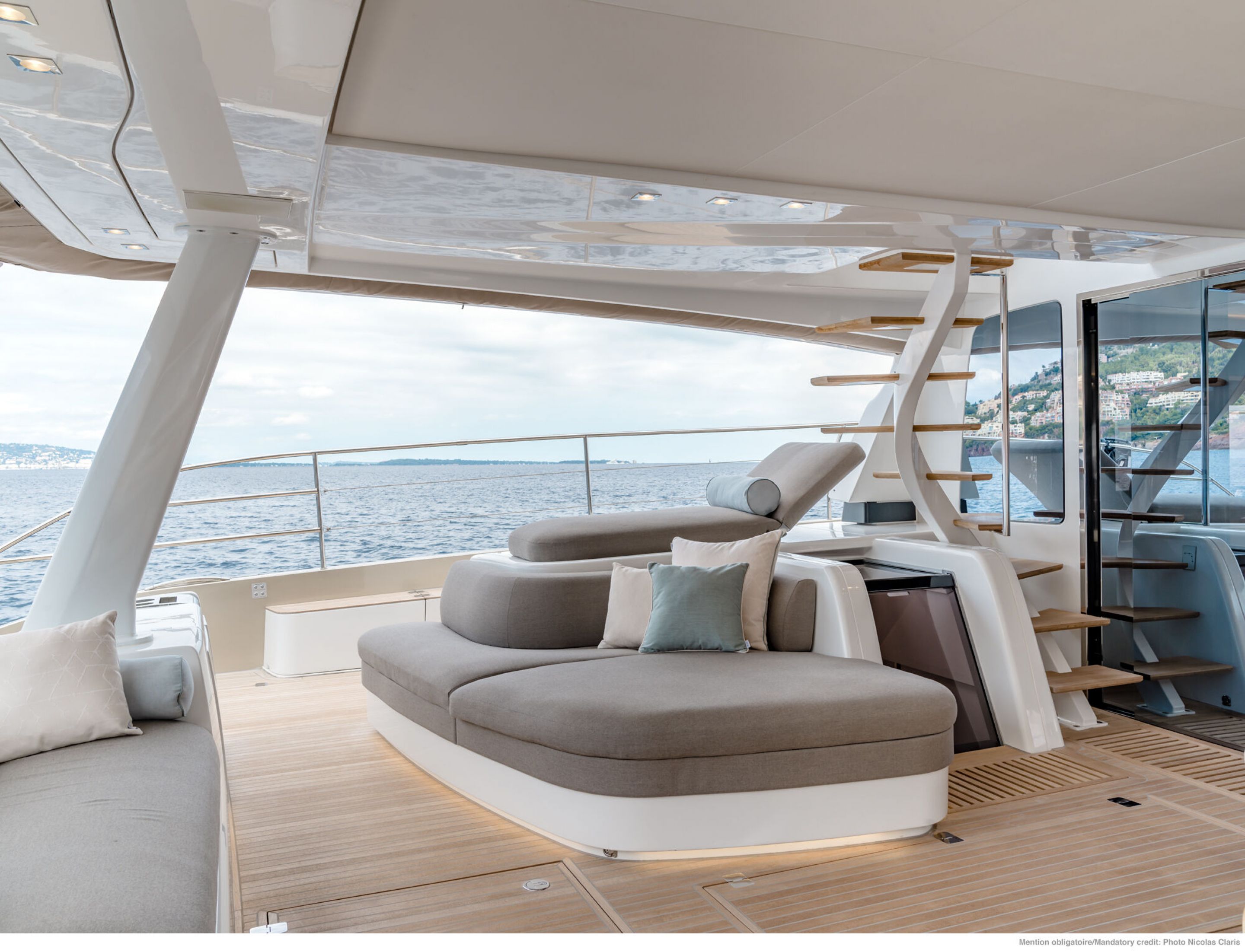 Aft deck lounge seating and stairs to flybridge