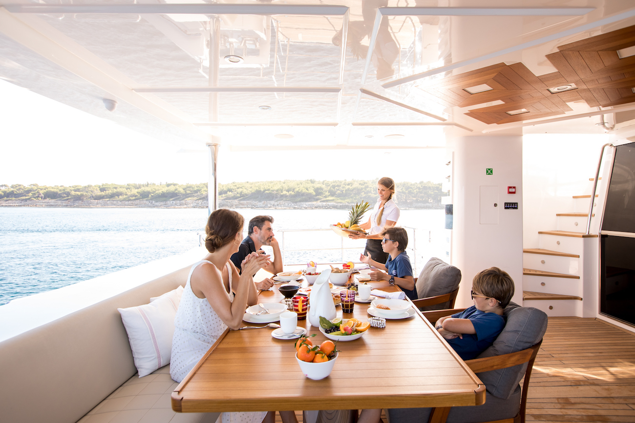 Lifestyle Dining With Family On Yacht