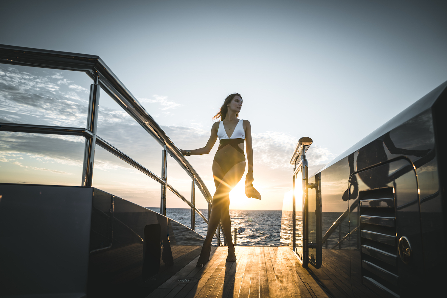 Model On A Yacht At Sunset