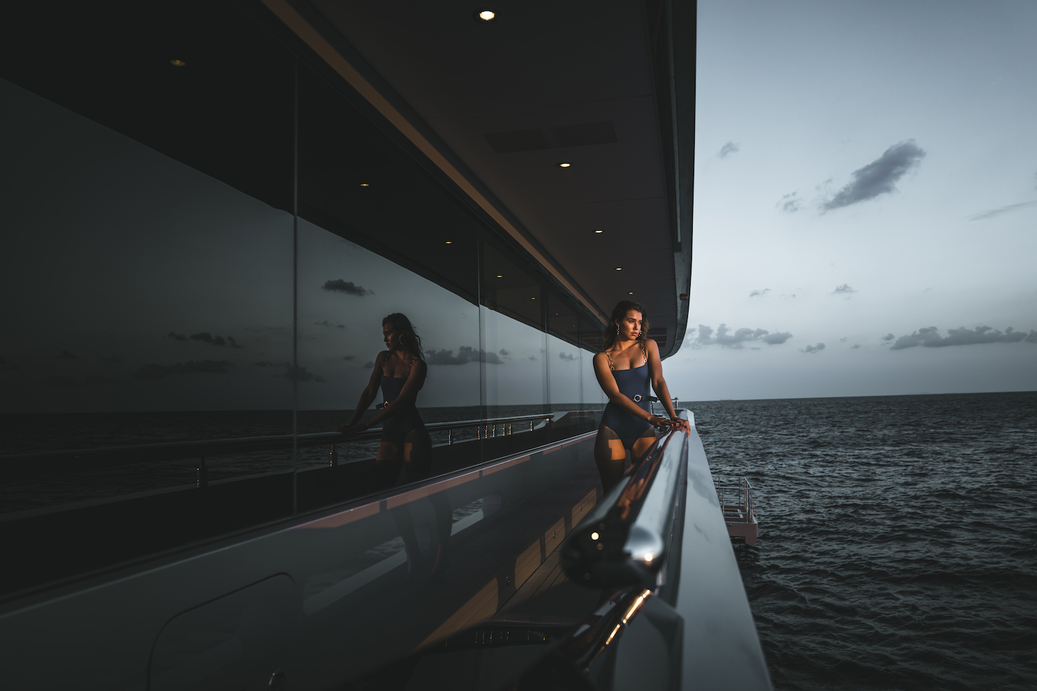 Model On A Yacht Side Deck