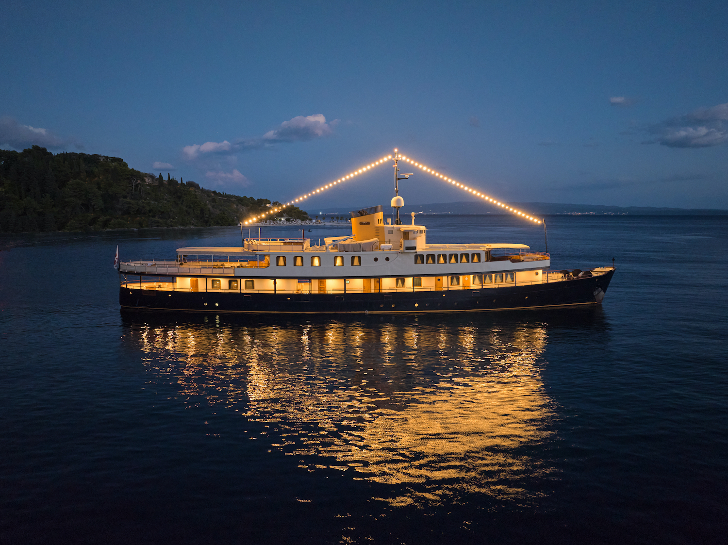 Profile Of The Yacht In The Evening With Lights