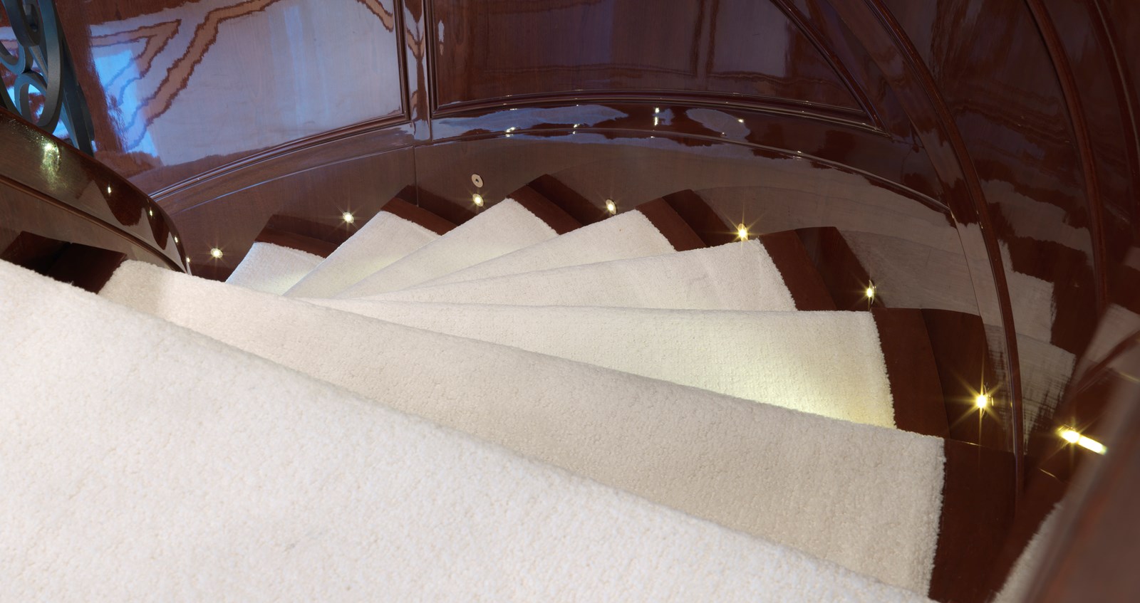 Stairwell Plush Carpet And Mahogany Wood Detail