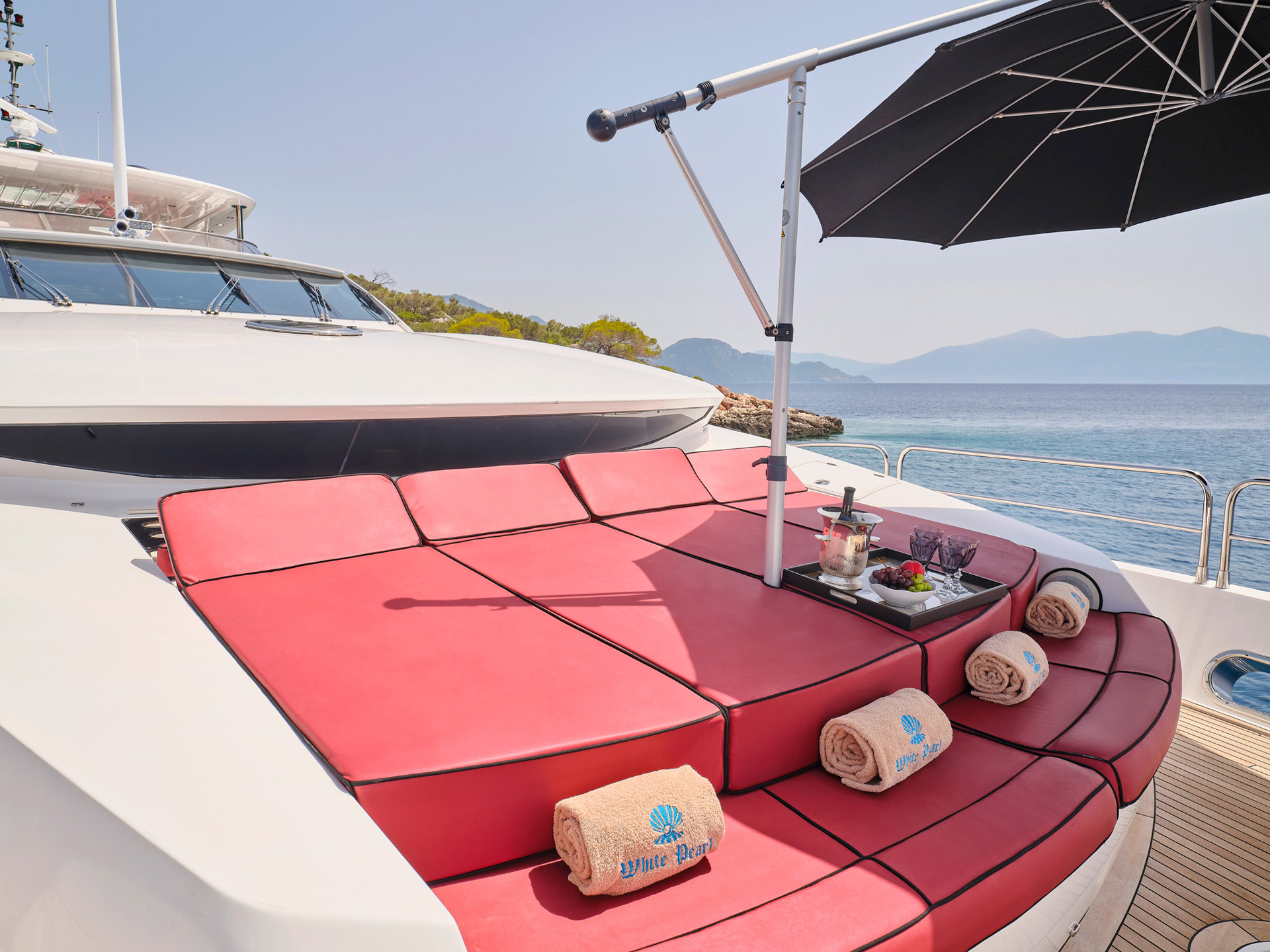 Foredeck sun pads with sunshade