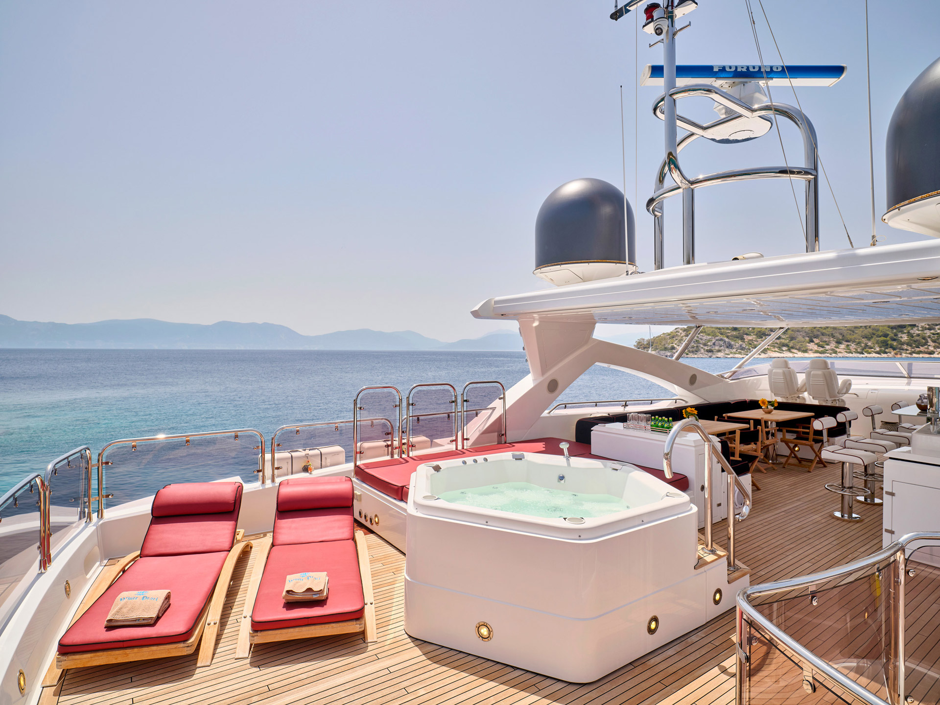 Sun deck jacuzzi and loungers