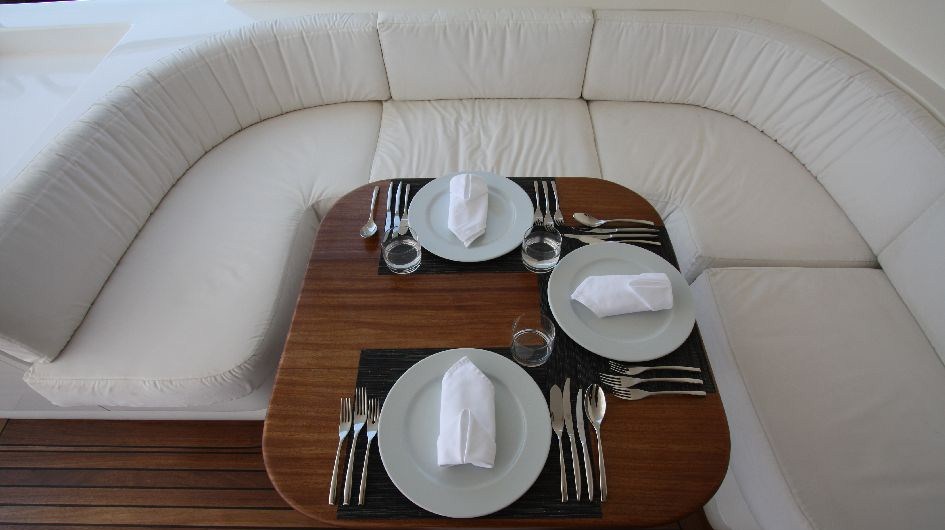 Al fresco dining on the upper deck of the MY Seven Spices - Image credit to Luxury Motor Yachts