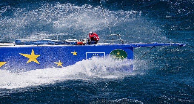ESIMIT EUROPA 2, fights the waves while leading the fleet after the start of the long race