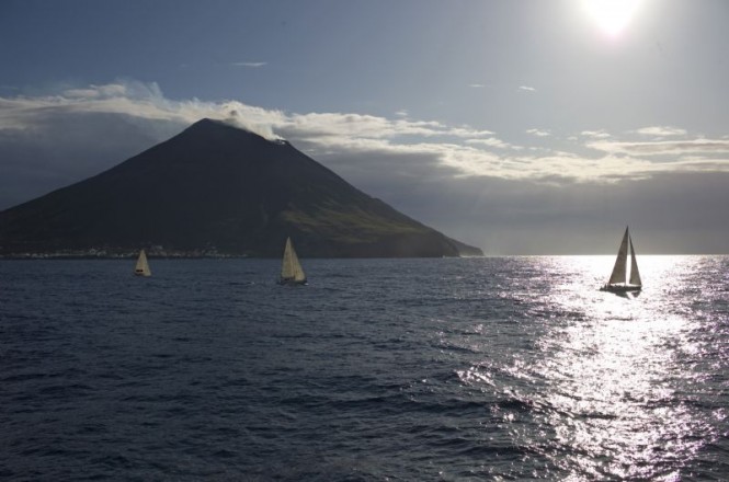 2009 Rolex Middle Sea Race - fleet passing Stromboli - Photo Credit to Kurt Arrigo/Rolex