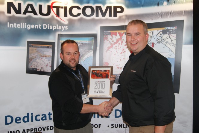Left to right Ryan Moore, Nauticomp presents 'Distributor of the Year Award' to Andrew Bush, C A Clase