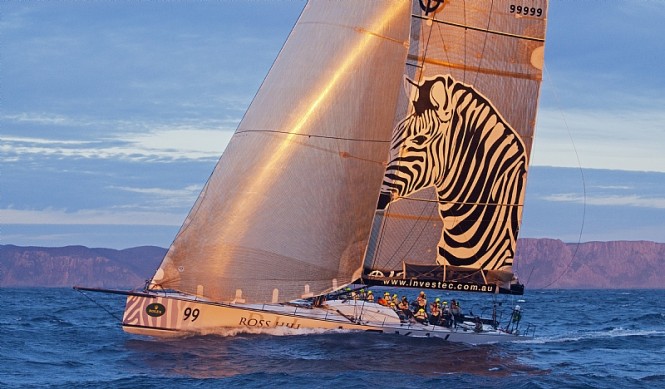 INVESTEC LOYAL catches the sunset off Tasman Island - Photo credit Rolex  Daniel Forster