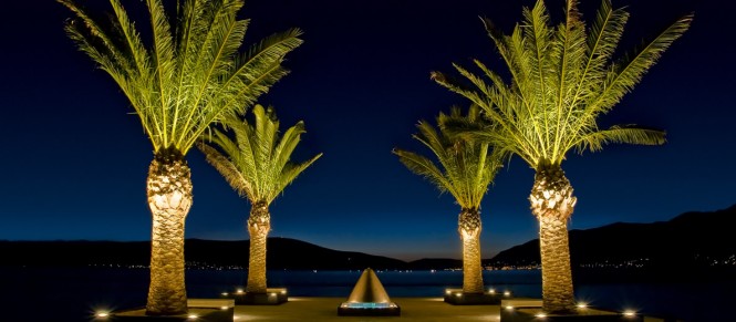 Jetty 2 with palm trees and fountains at dusk