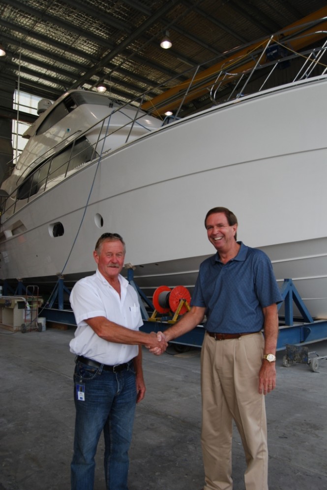 R Marine NZ dealer principal Bruce McGill is congratulated by Riviera CEO John Anderson on ordering the first 75 Enclosed Flybridge bound for New Zealand