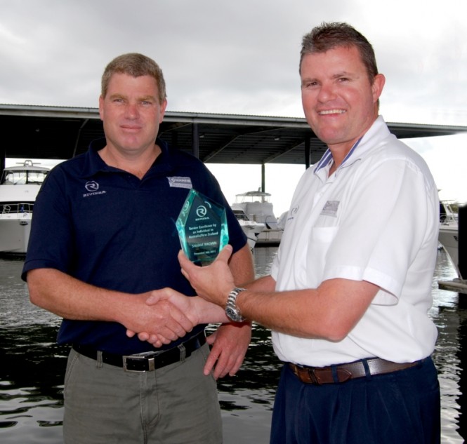 Service Award recipient Sharm Brown is congratulated by R Marine Queensland's dealer principal Randall Jones