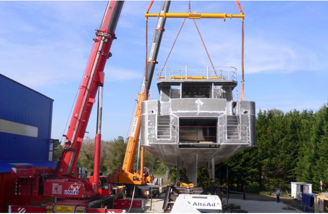 Alu Marine 33m yacht being taken out of the shipyard on a trailer