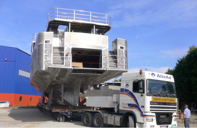 Alu Marine 33m yacht being transferred to another part of the shipyard