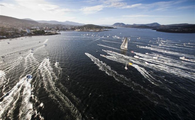 INVESTEC LOYAL Superyacht escorted by spectator craft before crossing the finish line Photo: ROLEX/D. Forster