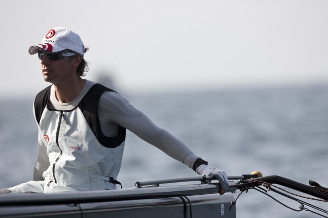 Ernesto Bertarelli, skipper of the Alinghi yacht on board on the first day of racing in Muscat