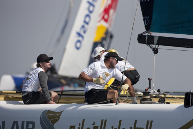 Morgan Larson at the helm of the sailing yacht Oman Air on day 1 Credit: Lloyd Images