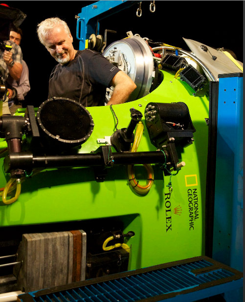 Cameron lowers himself into the sub for the Challenger Deep mission - Photo by M. Thiessen, National Geographic