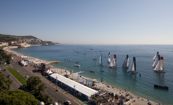 Extreme Sailing Series fleet racing only a few meters from the beach in Nice Credit Lloyd Images