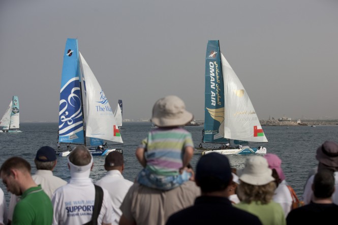 Spectators watching the racing with the yachts Oman Air and The Wave, Muscat leading the fleet Credit Lloyd Images