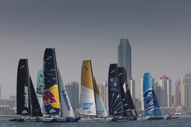 The Extreme 40 fleet racing in front of the impressive skyline in Fushan Bay, Qingdao Credit: OC Thirdpole