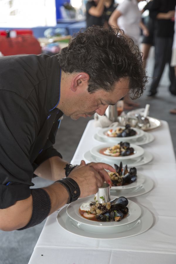Chef Jean Paul of the 150-foot motor yacht Encore took third place in the Grande Class with his dish that consisted of poached scallop and egg and steamed mussel. Photo Credit: Billy Black