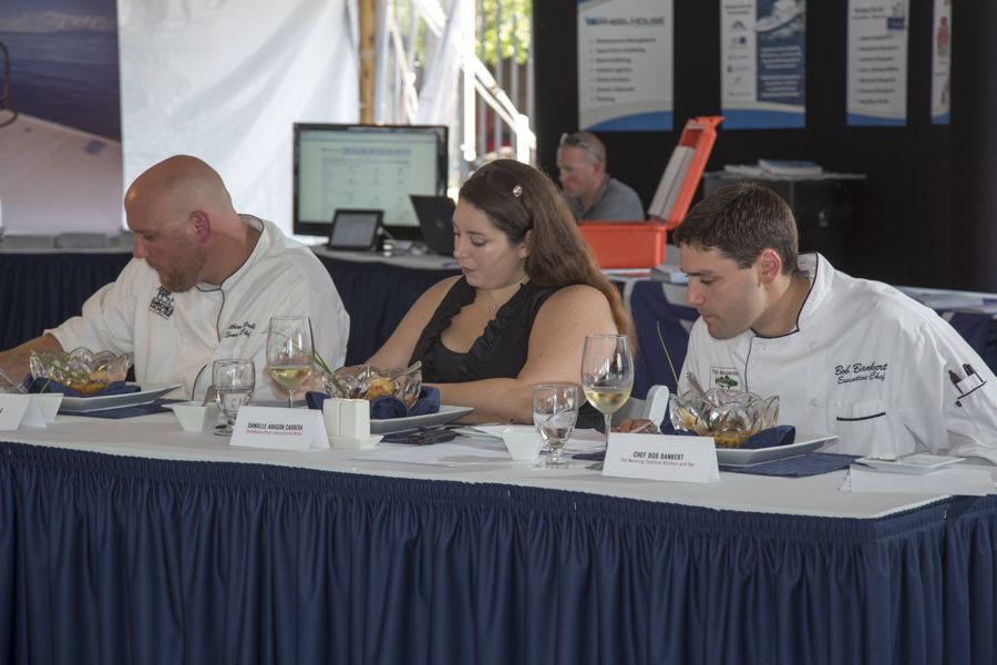 Judges of the Grande Class (from left to right): Chef Matt Preble of the Smokehouse, ShowBoats International Managing Editor Danielle Aragon Cabrera and Chef Bob Bankert of Mooring Seafood Kitchen and Bar. Photo Credit: Billy Black