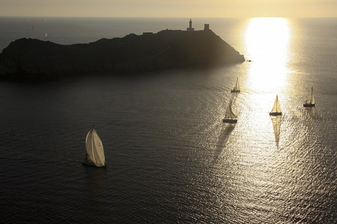 The Giraglia Rolex Cup fleet rounds the rock - Photo by Rolex/Carlo Borlenghi