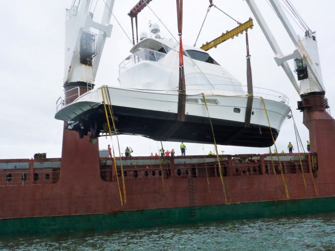 Riviera's first 75 Enclosed Flybridge is loaded onto a ship bound for New Zealand