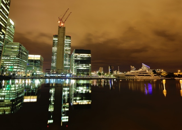 Superyachts anchored in the Thames by night