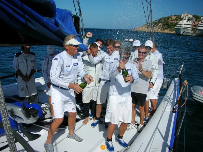 Crew aboard Esimit Europa 2 yacht celebrating