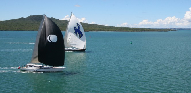 NZ Millennium Cup 2012: Day 1 - Sailing yacht Janice of Wyoming and Eclipse yacht battle it out while dormant volcano, Rangitoto, broods in the background. 