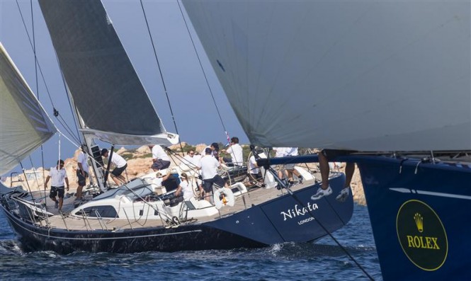 Sailing yacht Nikata ahead of her competitor's bow - Photo by RolexCarlo Borlenghi