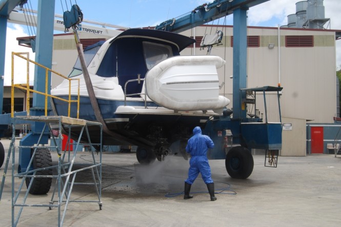 Detailers are cleaning the boats inside and out to ensure they are in mint condition