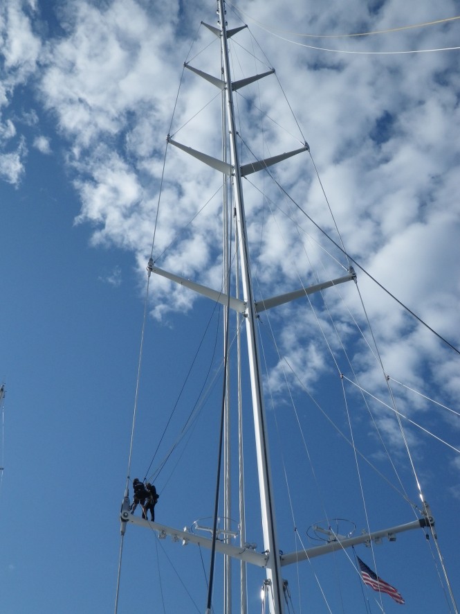 Marine Results personnel work on the gigantic M5 sailing yacht mast.