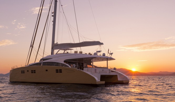 Splendid catamaran yacht HOUBARA at sunset