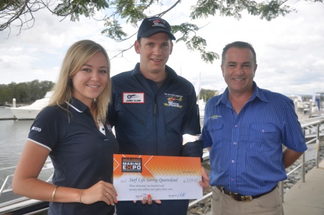 Emma Milne and Steve Sammes present the 2012 Expo donation to Jared Clark from the Westpac Surf Life Saver Helicopter Rescue Service