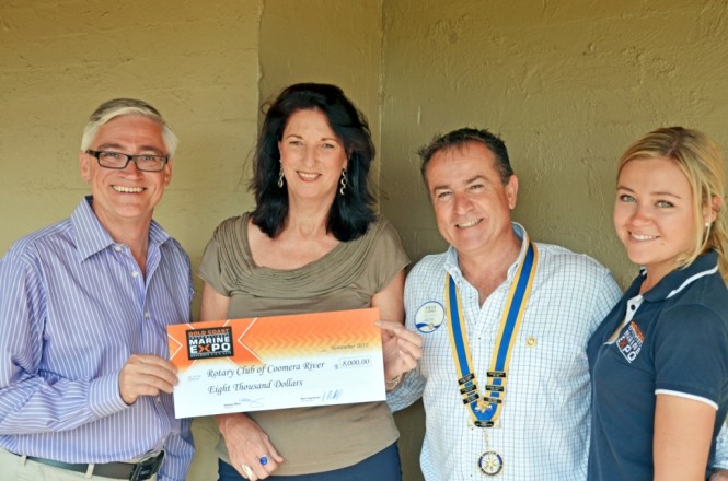 Pam Roberts from the Rotary Club of Coomera River  receives their donation from from Expo representatives