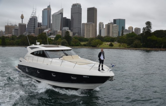 X Factor mentor and judge Ronan Keating stands on the bow of the Riviera 5800 Sport Yacht Buoy Toy