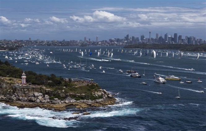 Bird's eye view of start of the 2012 Rolex Sydney Hobart, with cityscape in background - Photo by Rolex  Carlo Borlenghi