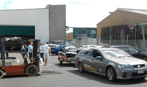 Mainsail and staysail of Ohana yacht getting ready to leave the sail loft with forklift for ligtinh the sails on to the trailer