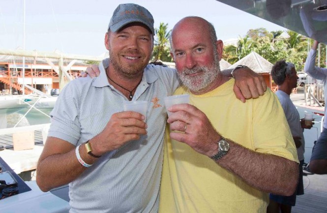 Phaedo's Lloyd Thornburg invites Peter Aschenbrenner to enjoy a celebratory glass of champagne on board to toast the 63ft trimaran, Paradox as winners of the Multihull Class:  Credit: Ocean Images/Team Phaedo