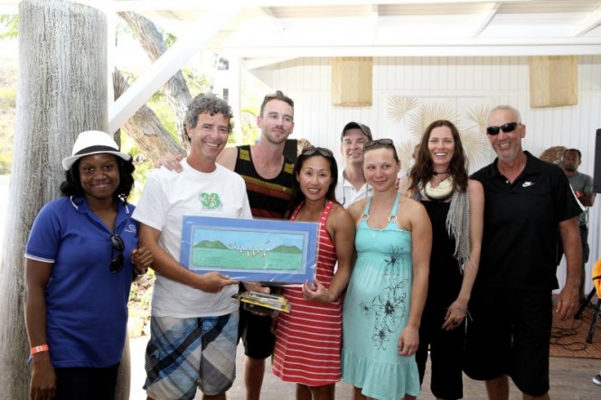 Ruth Phillips from Caribbean Insurers presents Hammertime II with Racing Class prize Credit- Alastair Abrehart