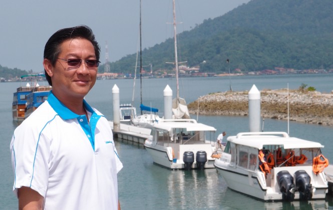 James Khoo General Manager PMSB with Gulf Craft yachts in the background