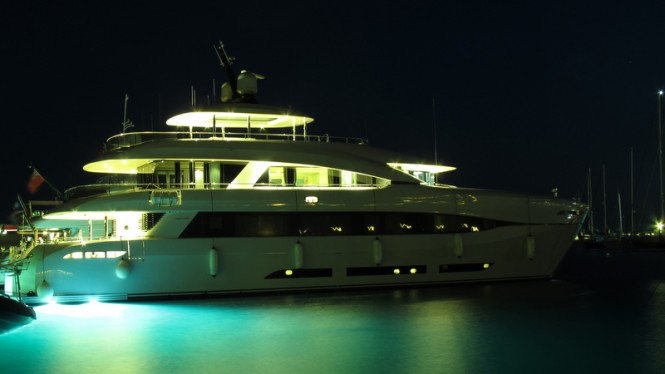 Quaranta Yacht by night with under water lights