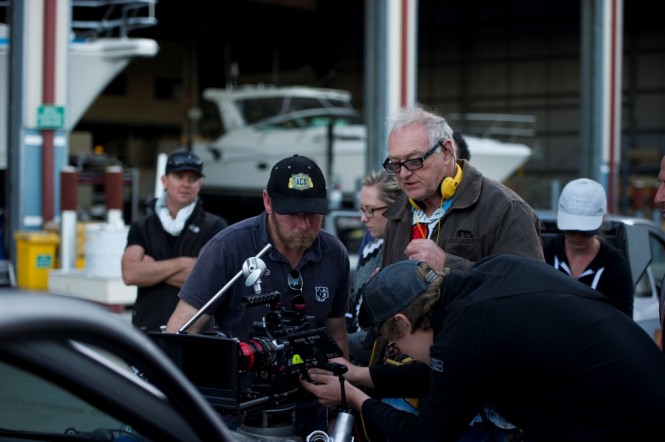 Director Brian Trenchard-Smith checks the footage